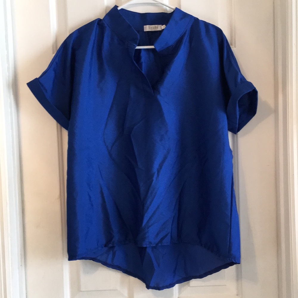 Blue blouse says 3xl but fits like Large